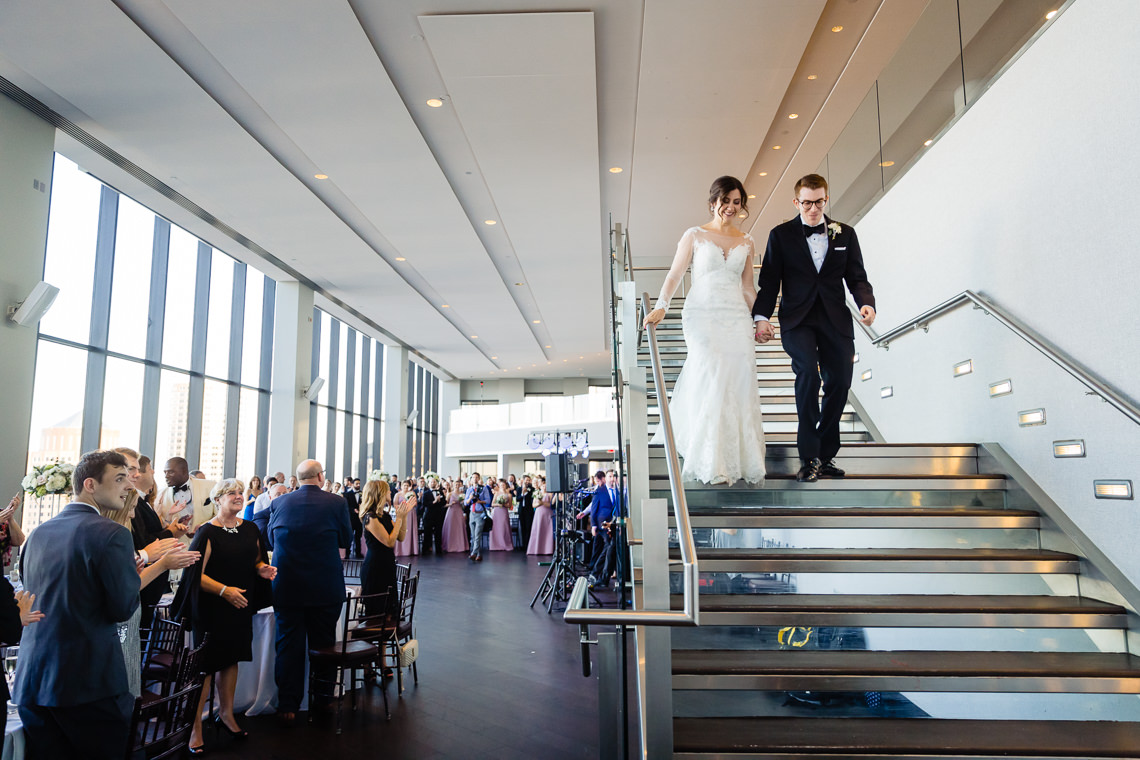 Wedding couple on staircase at State Room Boston