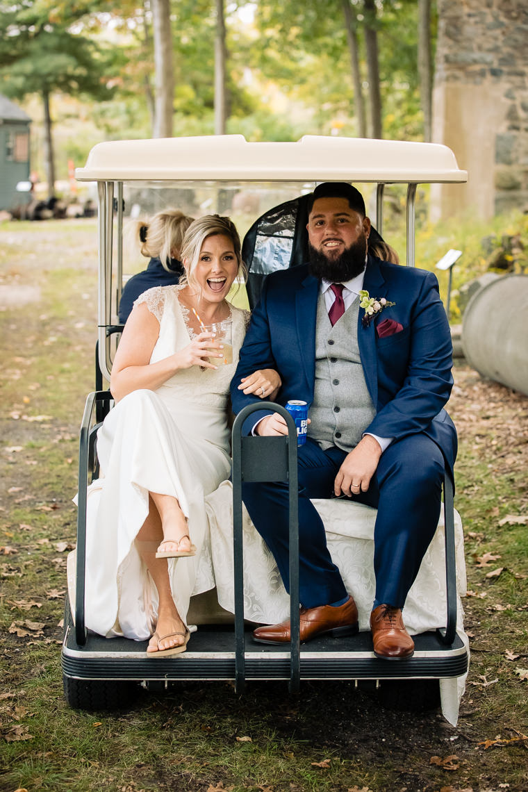 Bride and Groom on golf cart at Granite links